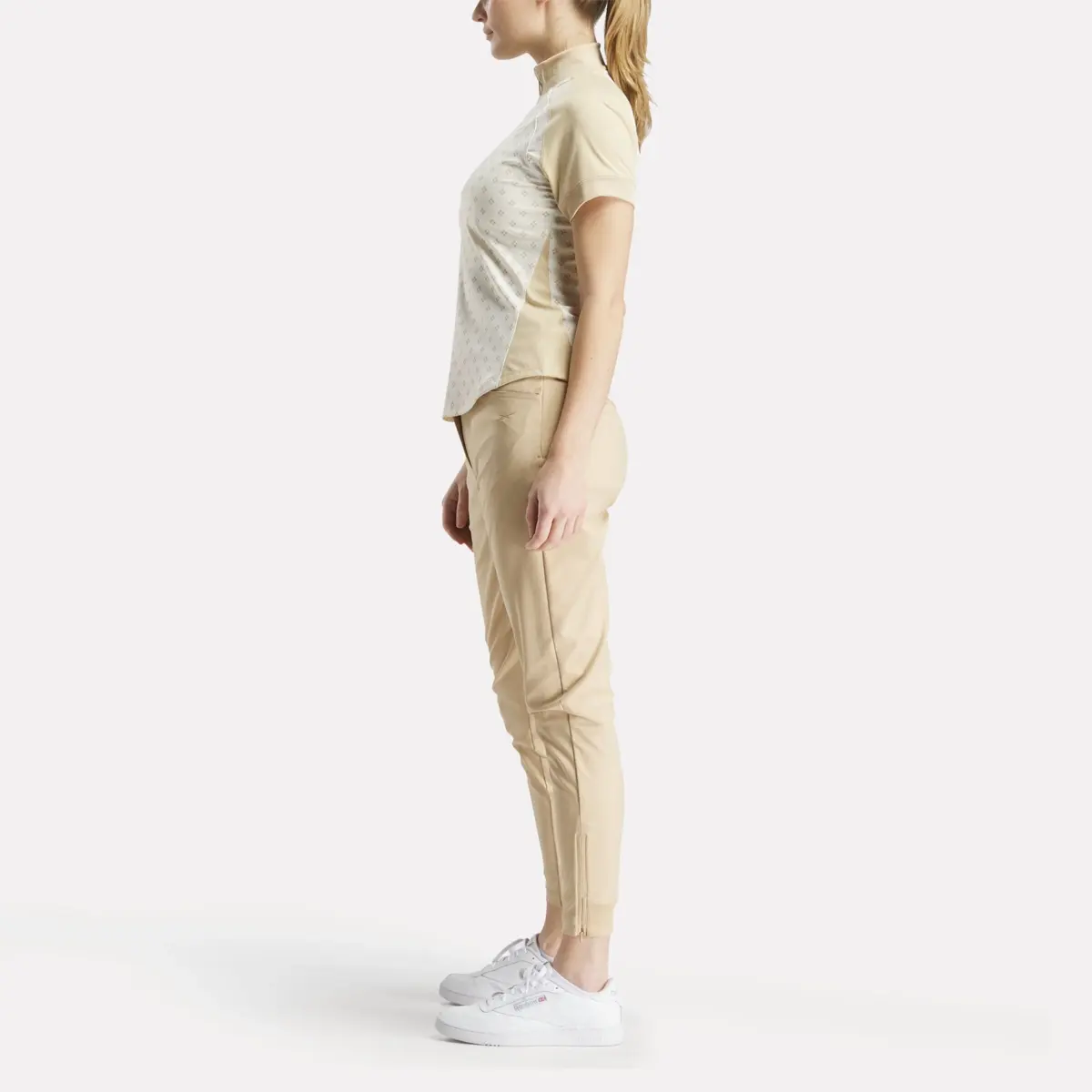 Damen-Kurzarm-Shirt mit 1/4-Reißverschluss und Mini-Argyle-Print